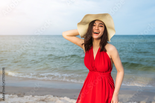 Wallpaper Mural cheerful woman in red dress enjoying on sea beach Torontodigital.ca