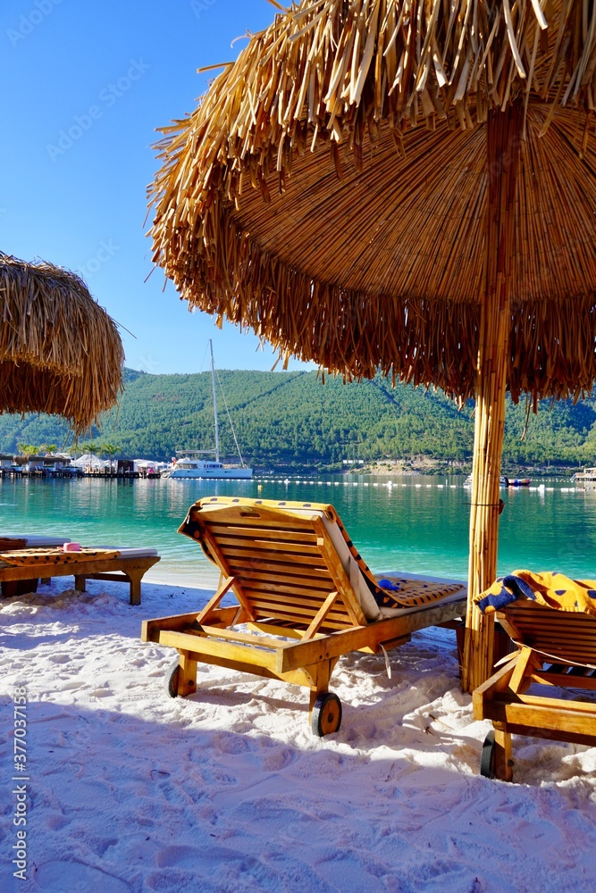 Bodrum, Turkey - August 2020: Hotel beach Lujo. Beautiful tropical beach banner. White sand travel tourism wide panorama background concept. Amazing beach landscape, yachts, Luxury tourism