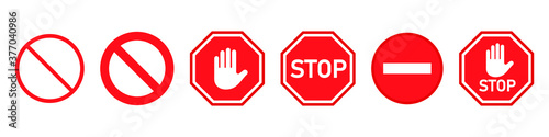 Red STOP sign with hand, traffic sign