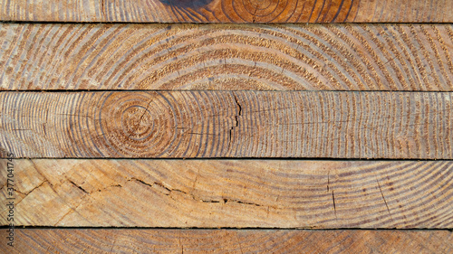 The cut-side view of the sawn panel showing the grain and the year ring.