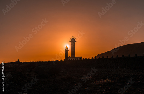 Silhouette of the Fuencaliente Lighthouse at sunset  on the route of the volcanoes south of the island of La Palma  Canary Islands  Spain