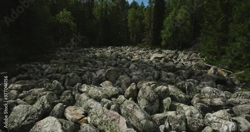 Stone river in South Ural /  place of difficult hiking, active lifestyle, explore and discover concept in rocky valley. Aerial drone wide shot at summer sunny day photo