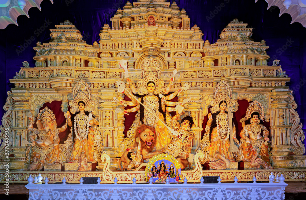 Durga Puja or Durgotsava,is an annual Hindu festival celebrated mainly in West Bengal,India.Durga is Goddess riding a lion with many arms each carrying weapons and defeating evil power of Mahishasura.