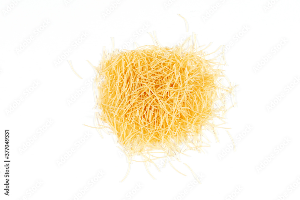 Top view of uncooked vermicelli pasta on white background. Dry uncooked vermicelli pasta