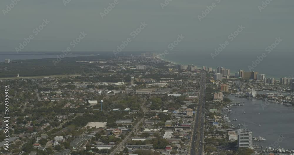 Destin Florida Aerial v4 pan right and tilt down on downtown and the bay with resorts - DJI Inspire 2, X7, 6k - March 2020 Destin Florida Aerial v4 pan right and tilt down on downtown and the bay with resorts - DJI Inspire 2, X7, 6k - March 2020