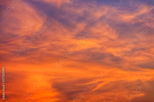 red sky with clouds at sunrise or sunset © Matthias