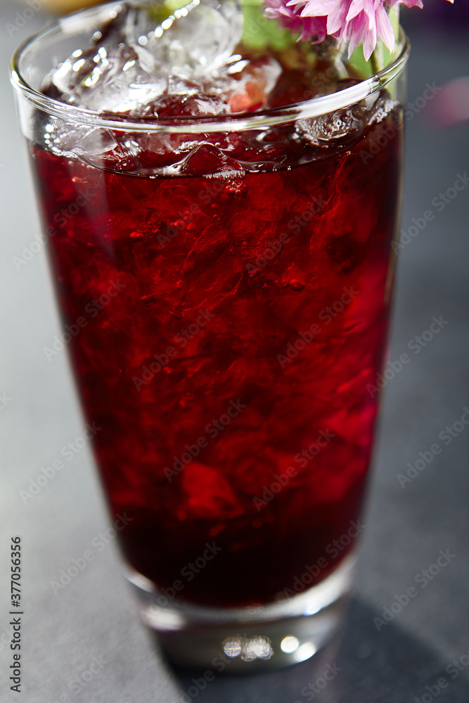 Freshness cocktail with cherry and ice cube Freshness cocktail with cherry and ice cube