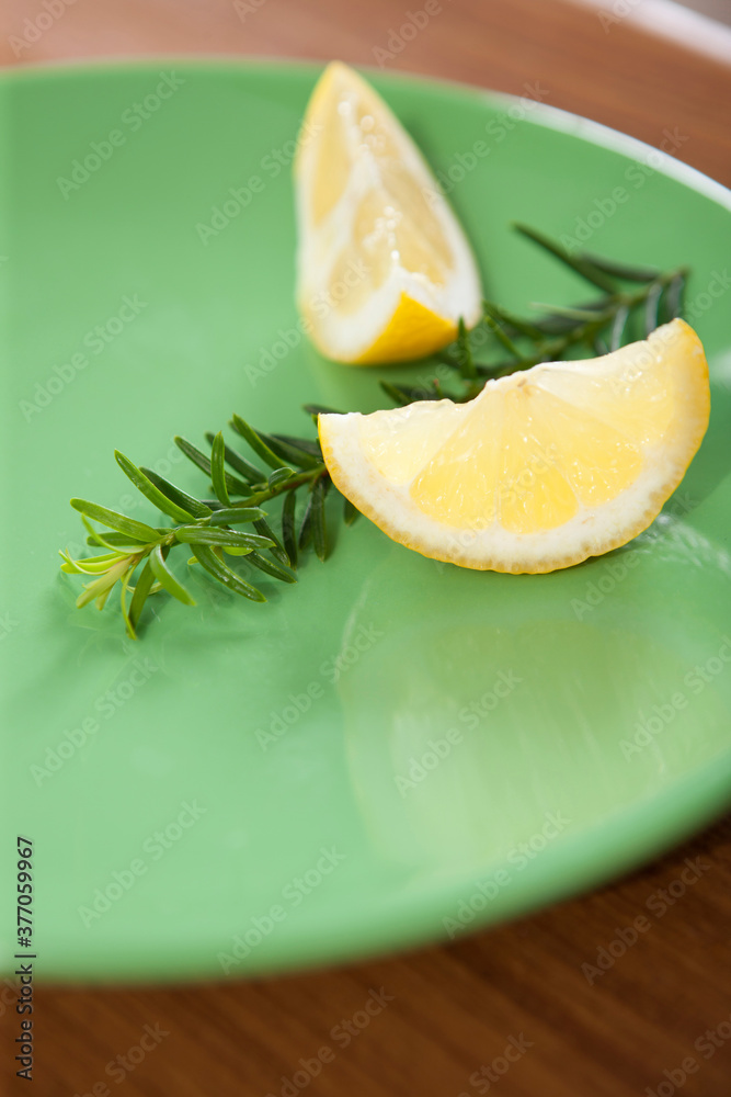 slice of lemon on plate slice of lemon on plate