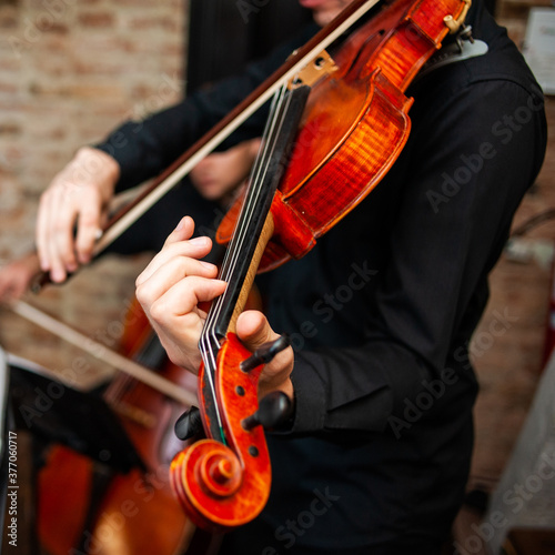A male violinist studies music by notes