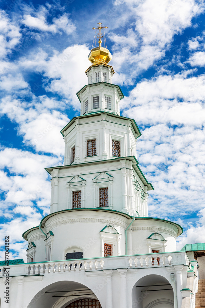 Temple new jerusalem. Exterior. Magnificent architecture on a summer day against the backdrop of a bright blue cloudy sky. Vertical.