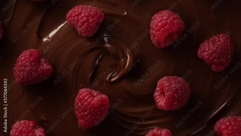 melted chocolate and raspberry top view rotating