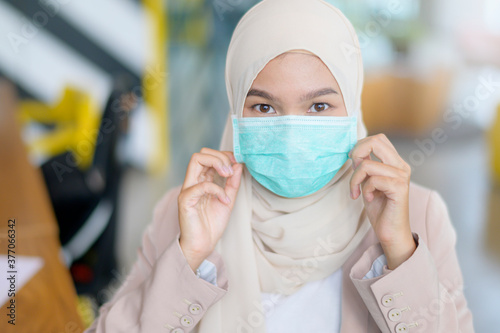 Muslim woman wearing face mask during virus pandemic. 