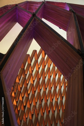 Wooden sculpture bathed in soft light.