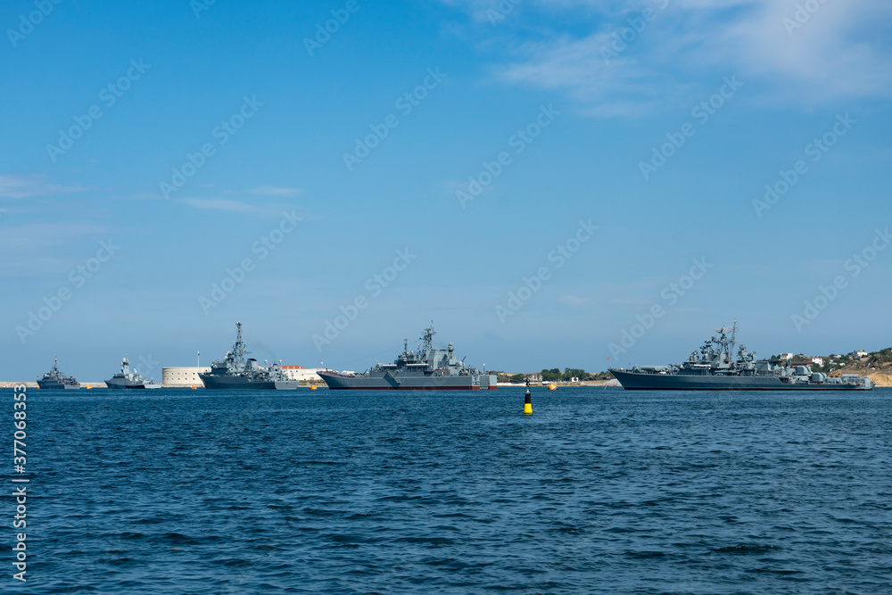 A group of warships at the seaport.