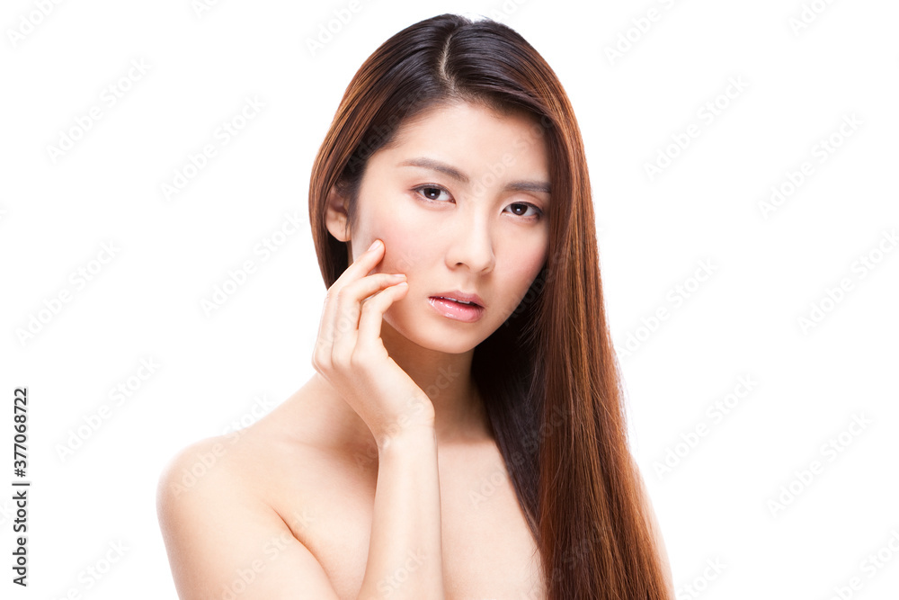 Young beautiful woman touching her face Young beautiful woman touching her face