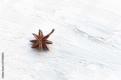 Fototapeta Naklejka Na Ścianę i Meble -  star anise on a white background. this aromatic spice is used for cooking food and various drinks