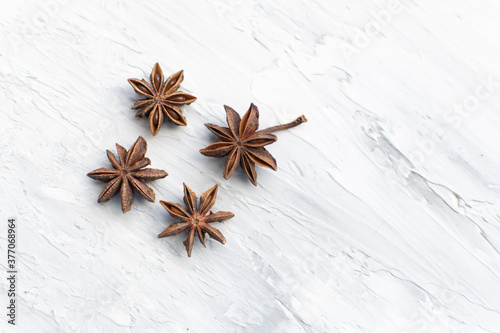 Fototapeta Naklejka Na Ścianę i Meble -  star anise on a white background. this aromatic spice is used for cooking food and various drinks