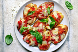 Grilled bruschetta with tomato and mozzarella. Top view with copy space.