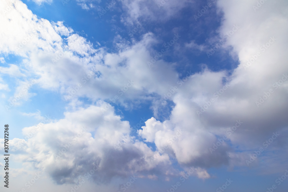 sunning cloudscape on a summer day. beautiful sunny weather forecast. dynamic cloud formation on the blue sky sunning cloudscape on a summer day. beautiful sunny weather forecast. dynamic cloud formation on the blue sky