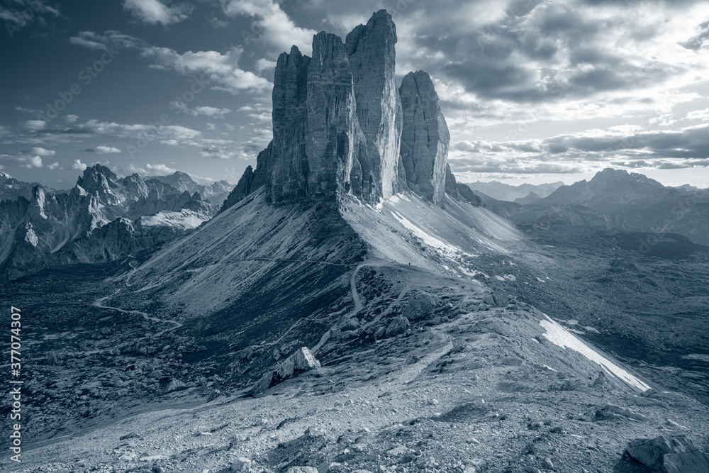 Three Peaks of Lavaredo. Toned image of Italian Dolomites with famous Three Peaks of Lavaredo (Tre Cime di Lavaredo) South Tyrol, Italy, Europe at summer sunset.