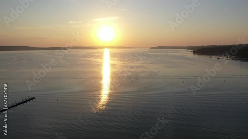 aerial shot of lake geneva, Wisconsin during golden hour over a marina.
