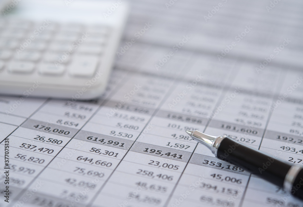 pen, calculator and business analysis report on desk of financial advisor. financial accounting concept. pen, calculator and business analysis report on desk of financial advisor. financial accounting concept.