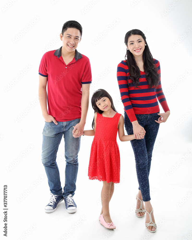 Southeast Asian family parents daughter father mother child pose happy walk hand in hand on white background Southeast Asian family parents daughter father mother child pose happy walk hand in hand on white background