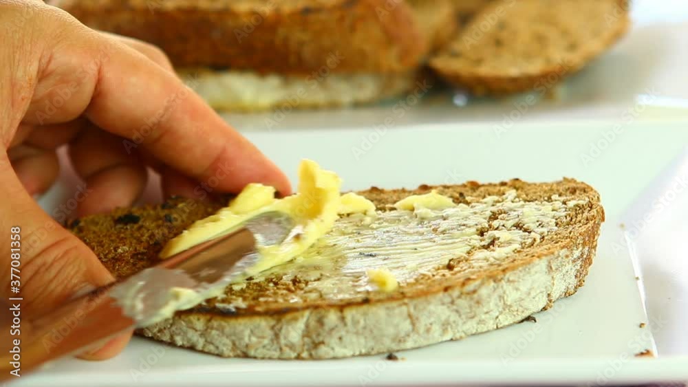 Spreading cheese on bread , in door Chiangmai Thailand Spreading cheese on bread , in door Chiangmai Thailand