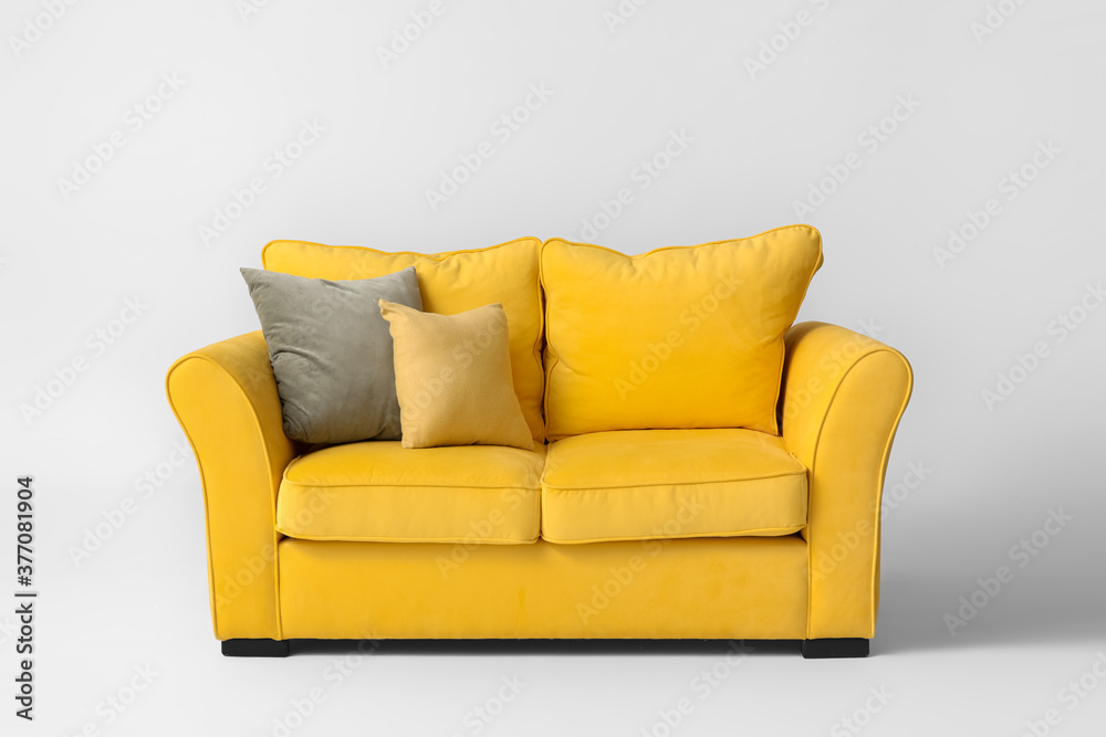Fototapeta premium Stylish sofa on light background