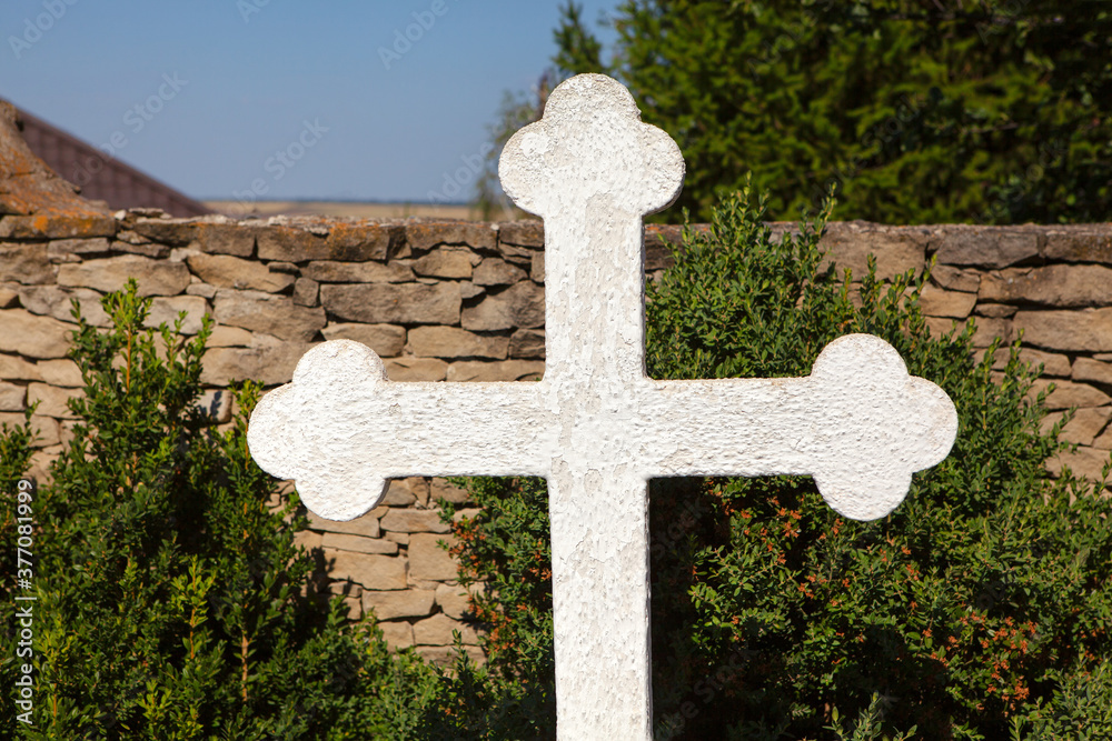 White stone religious cross symbol of Christianity 