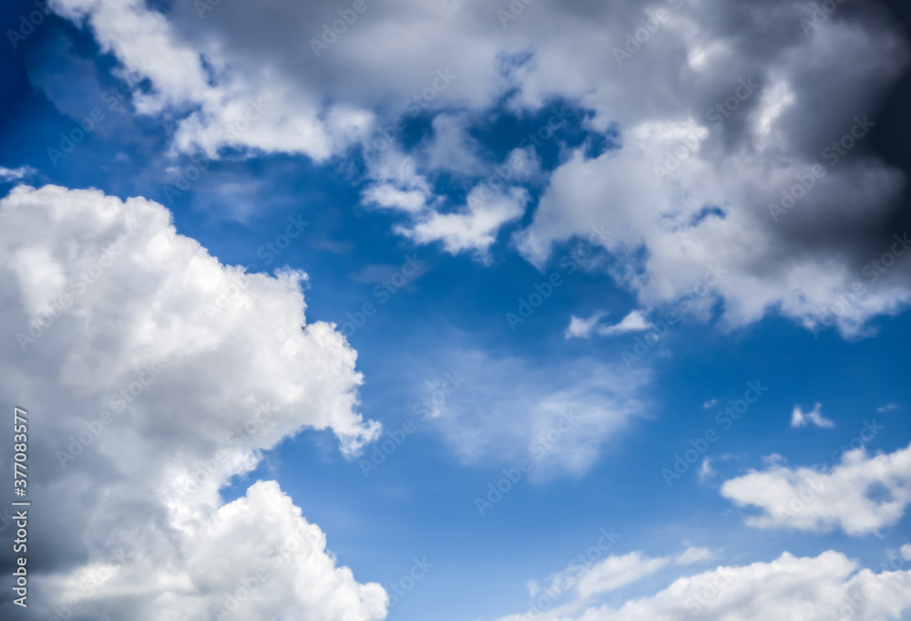 Beautiful combination of white and dark clouds in a blue sky Beautiful combination of white and dark clouds in a blue sky