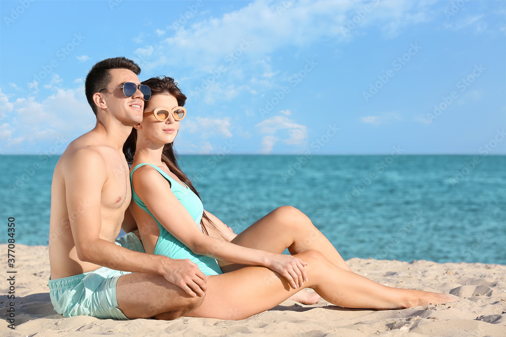 Happy young couple on sea beach Happy young couple on sea beach