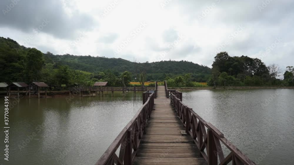 Wooden bridge with mountainscape background. Wooden bridge with mountainscape background.