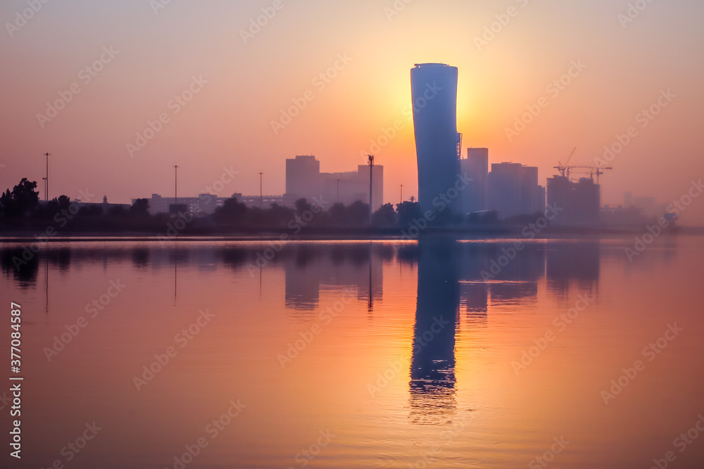 Sunrise Sky view background behind capital gate tower of Abu Dhabi, Skyscrapers in Capital city of United Arab Emirates