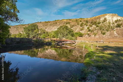 Old pond over the little river. Miracle natural landscape