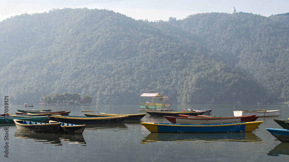 View over a few colorful boats on Phewa Lake, Pokhara