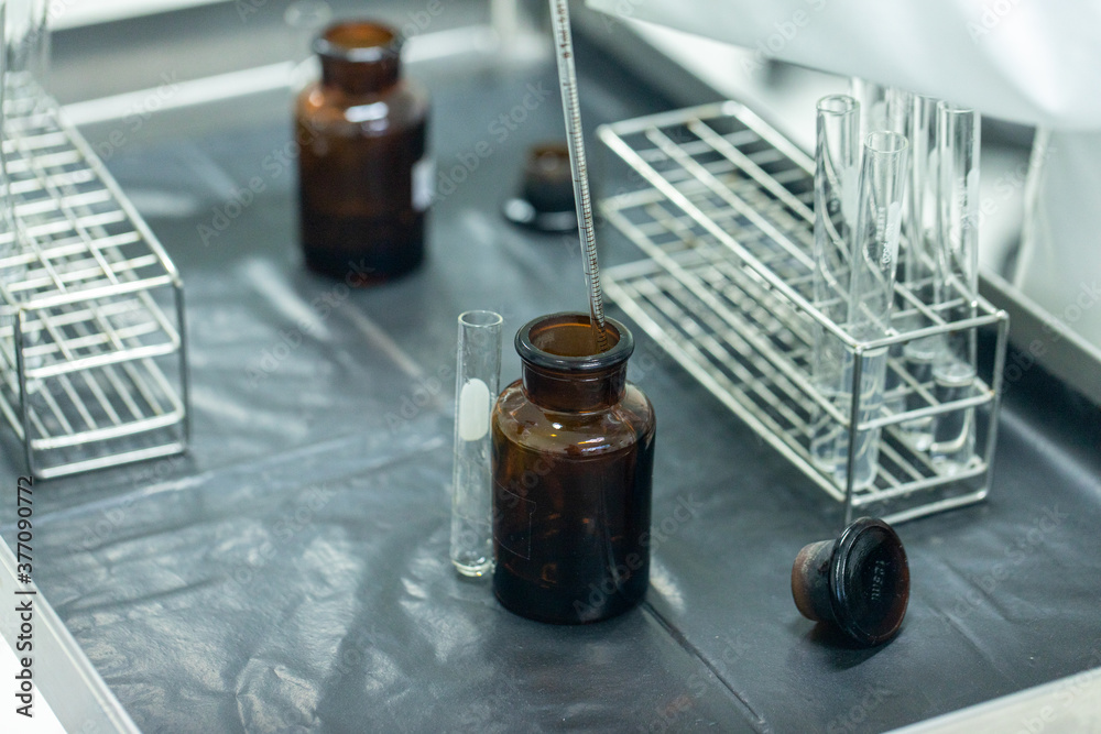 Sample analysis using Spectrophotometer for lab experiments. Stock Photo Adobe Stock