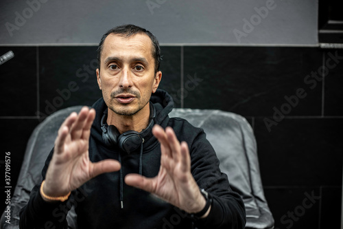 portrait of man sitting in street in protection movement © Rick Neves