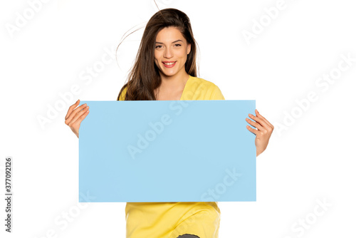 young beautiful happy woman holding a blue empty board © vladimirfloyd