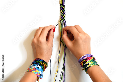 Valokuva Process of weaving knot for DIY friendship bracelet Pigtail