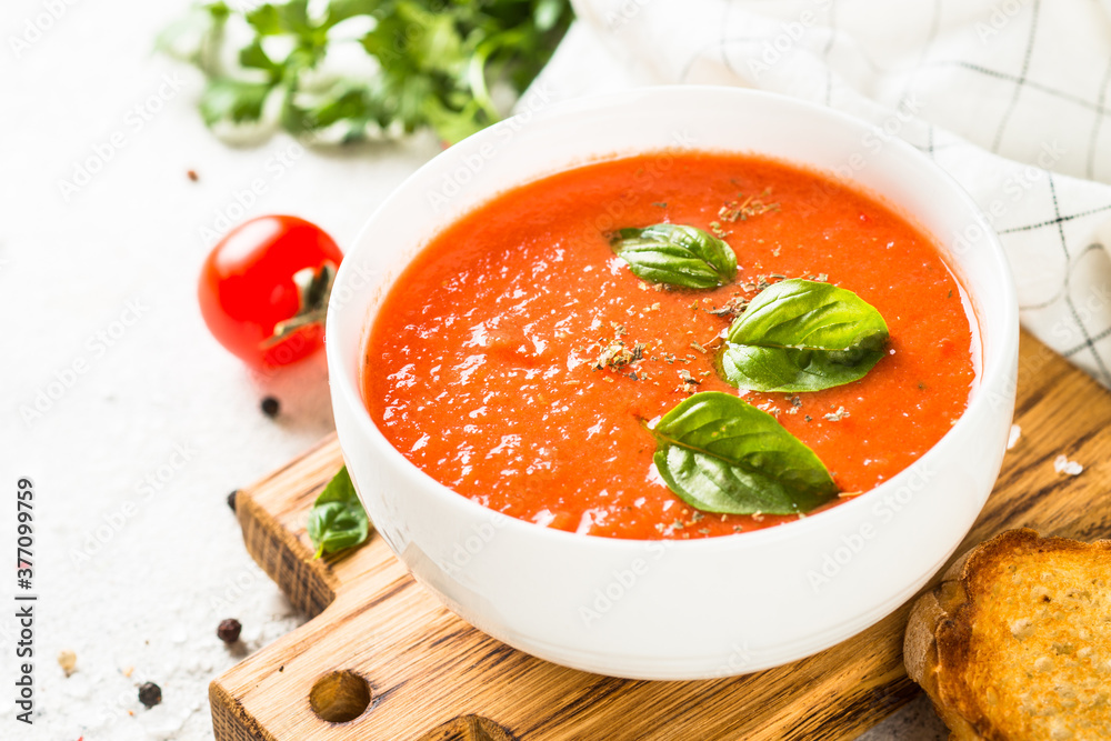 Tomato soup at white table. Tomato soup at white table.