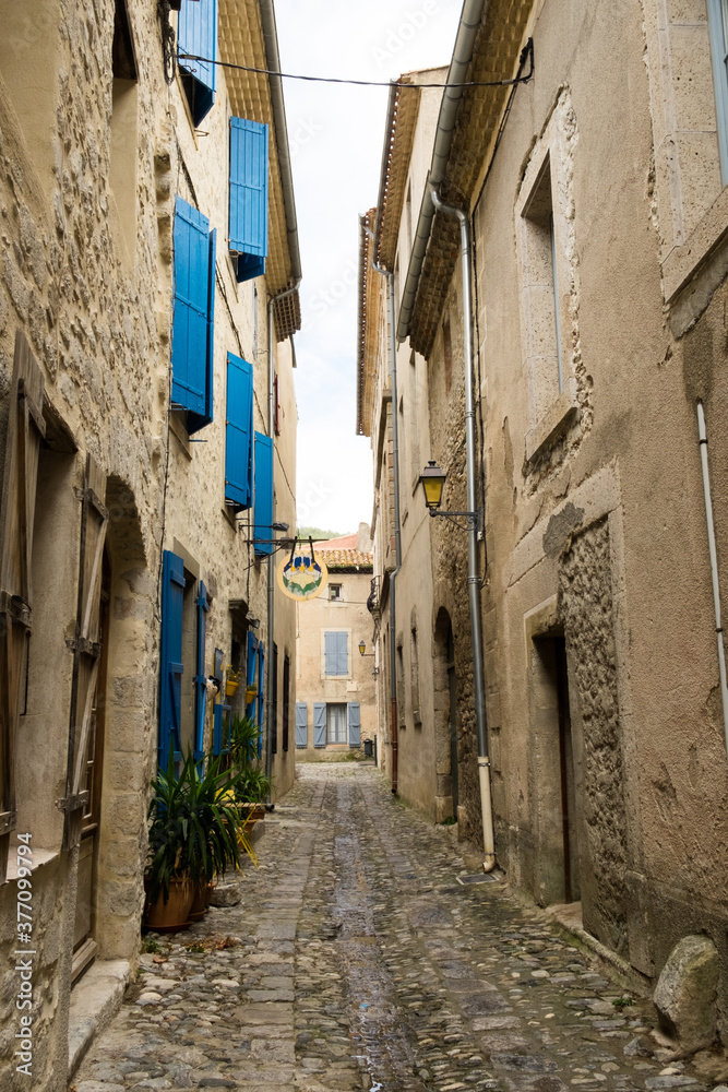 The medieval stone architecture and the old narrow street of Lagrasse, the most beautiful medieval village of France, located in the picturesque mountain  valley in Pyrenees