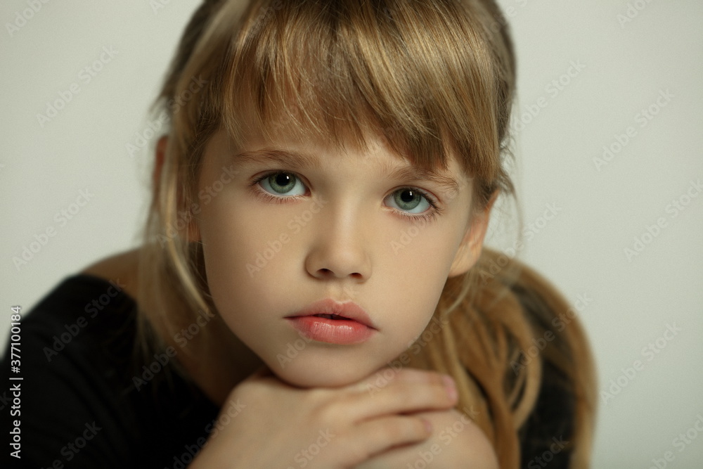 Portrait of a beautiful little blonde girl in the studio Portrait of a beautiful little blonde girl in the studio