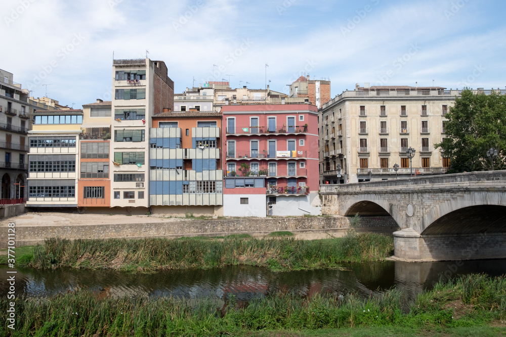 The beautiful cityscapeand the bridge upon Onyar river in the medieval city of Girona, Spain