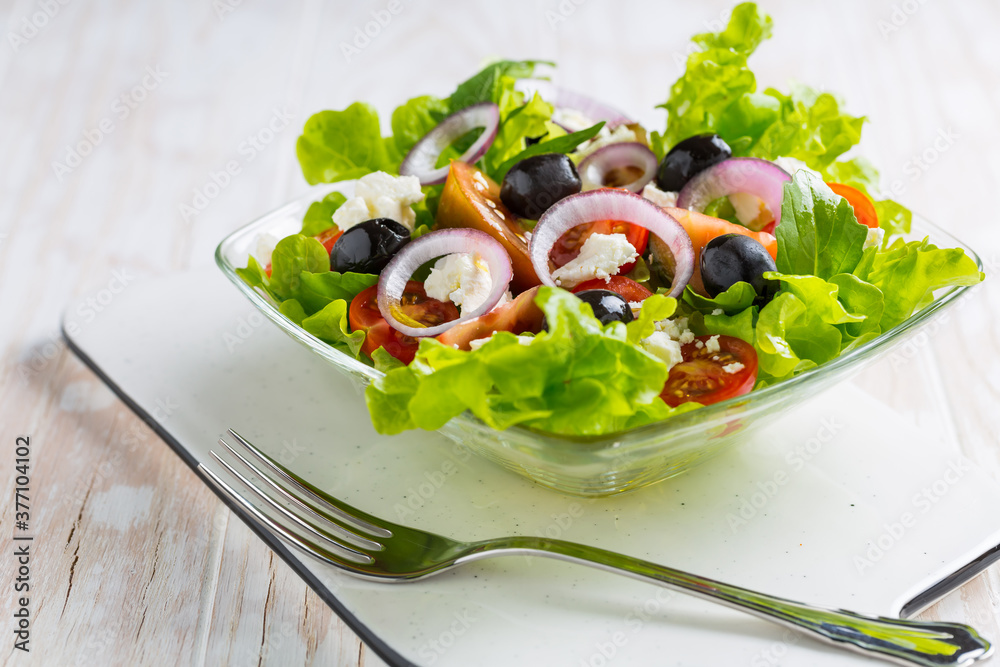 Greek salad with feta cheese, black olives and onion Greek salad with feta cheese, black olives and onion