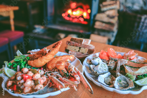 Hearty and delicious seafood platter next to Wood Burning Stove at Applecross Inn, Scottish highlands Winter , Scottish cuisine. Scotland travel. UK