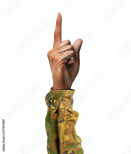 Soldier hand showing forefinger up and number one sign in a white isolated background