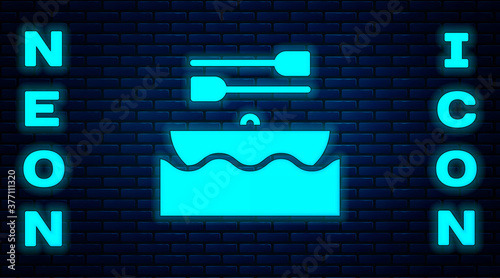 Glowing neon Boat with oars icon isolated on brick wall background. Water sports, extreme sports, holiday, vacation, team building. Vector.