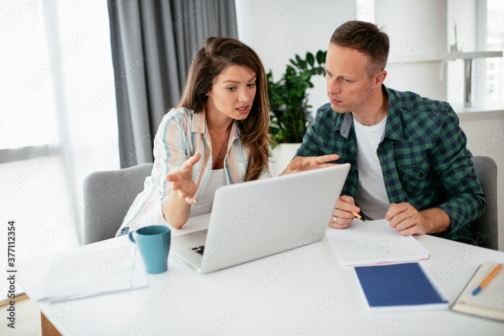 Husband and wife preparing bills to pay. Young couple having financial problems... Husband and wife preparing bills to pay. Young couple having financial problems...