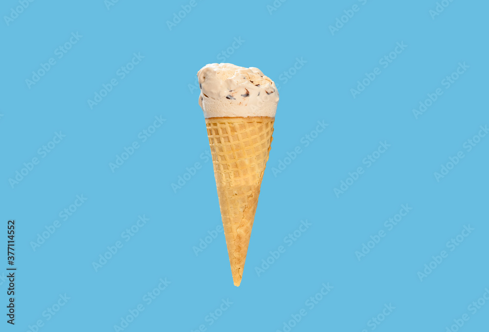 milk tea flavor ice cream cone with some bites on a blue background horizontal composition milk tea flavor ice cream cone with some bites on a blue background horizontal composition